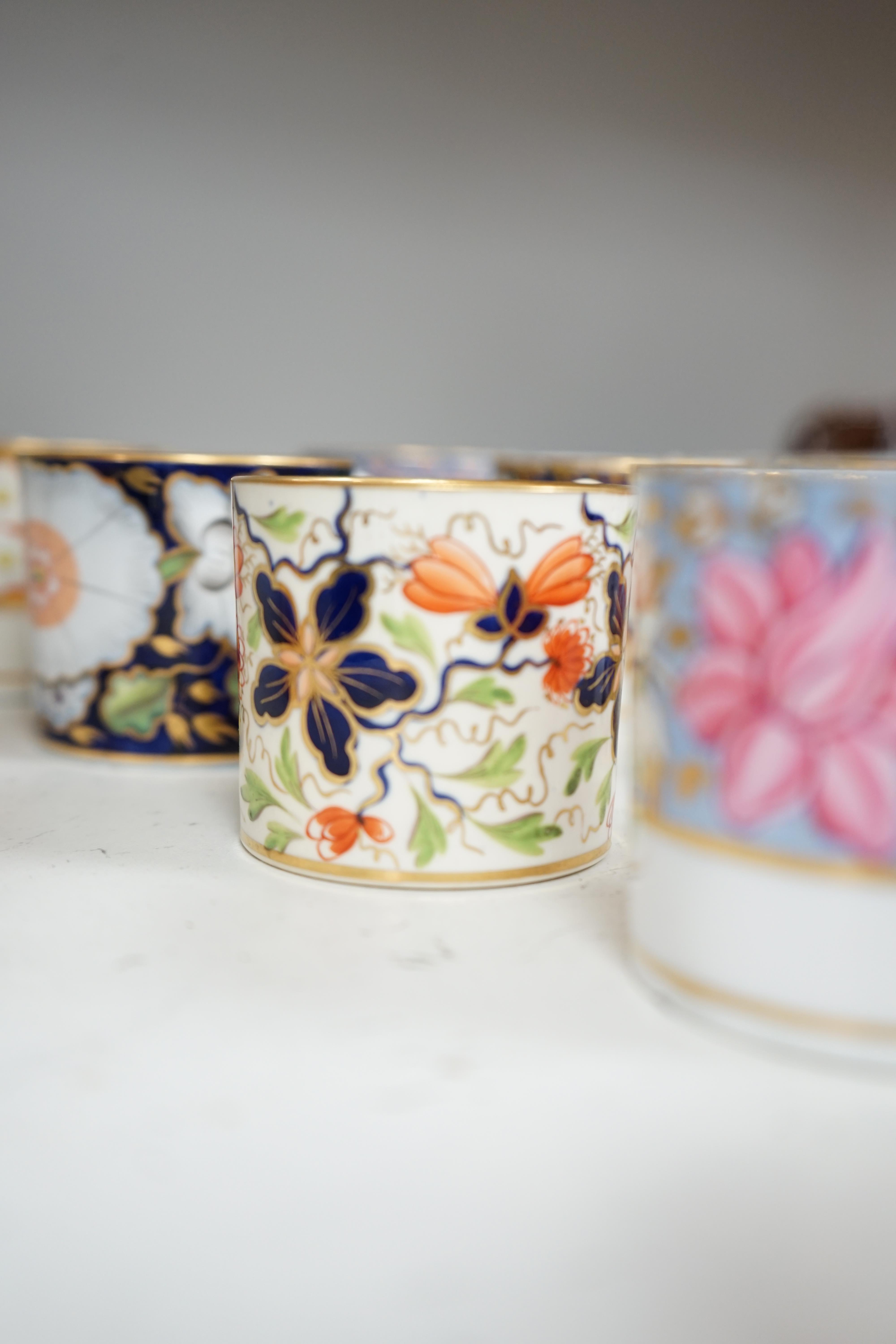 Twelve 1800-1820 English porcelain floral designed coffee cans